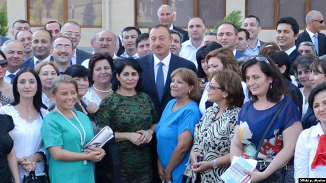 Azerbaijani President Ilham Aliyev meets with journalists at the inauguration ceremony for the new apartment building in Baku.