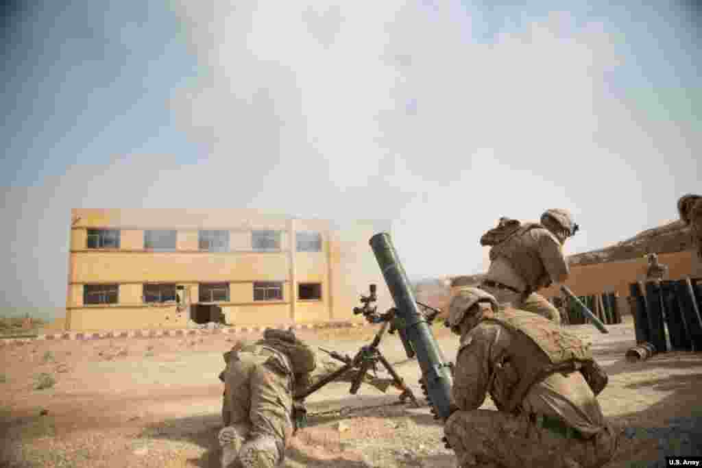 U.S. Marines pop a mortar towards an IS target in eastern Syria in October 2018. U.S. forces have also launched "kill or capture" missions targeting prominent IS leaders. 
