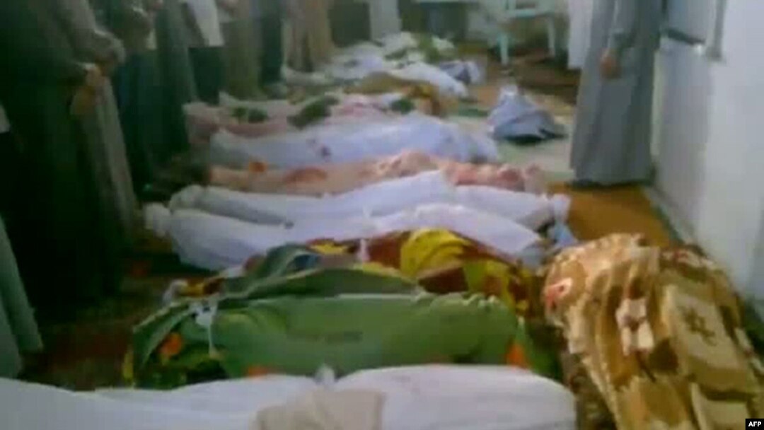 A video grab allegedly shows bodies of men who were killed in a reported massacre in the Syrian village of Tremseh on July 12.