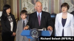 U.S. Senator Benjamin Cardin speaks alongside members of Sergei Magnitsky's family (left to right: Magnitsky's widow, Natalia; his son, Nikita; Senator Cardin; and Magnitsky's mother, Natalia)