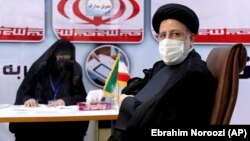 Ebrahim Raisi, the head of Iran's judiciary registers as a candidate for the June 18 presidential elections in Tehran last month.