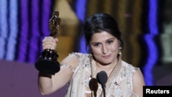 Pakistani filmmaker Sharmeen Obaid Chinoy accepts the Oscar for the Best Documentary Short Subject for their film "Saving Face" at the 84th Academy Awards in Hollywood on February 26.