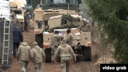 Imagine din timpul căutărilor la baza de pregătire sub egida NATO, din Lituania, unde patru soldați americani au dispărut în timpul exercițiilor militare.