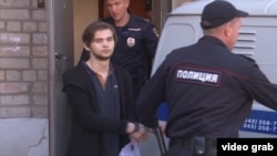Ruslan Sokolovsky played Pokemon Go on his phone inside a church.
