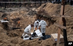 Ексгумація вбитих під час окупації Ізюма, осінь 2022 року