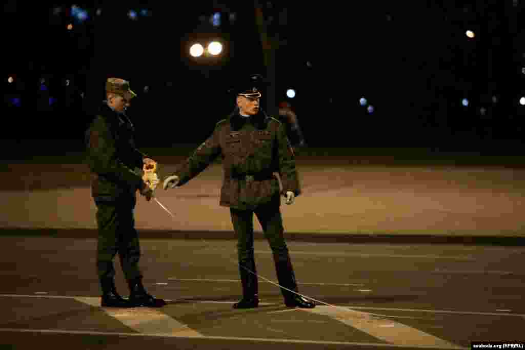 Soldiers mark the area for the parade. 