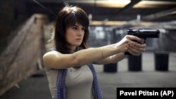 Maria Butina, a gun-rights activist, posing for a photo at a shooting range in Moscow in 2012.