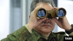 Russian Defense Minister Sergei Shoigu observing military exercises in 2014. 