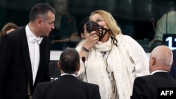 Diana Iovanovici Sosoaca wears a muzzle in the European Parliament in Strasbourg, France, in July.