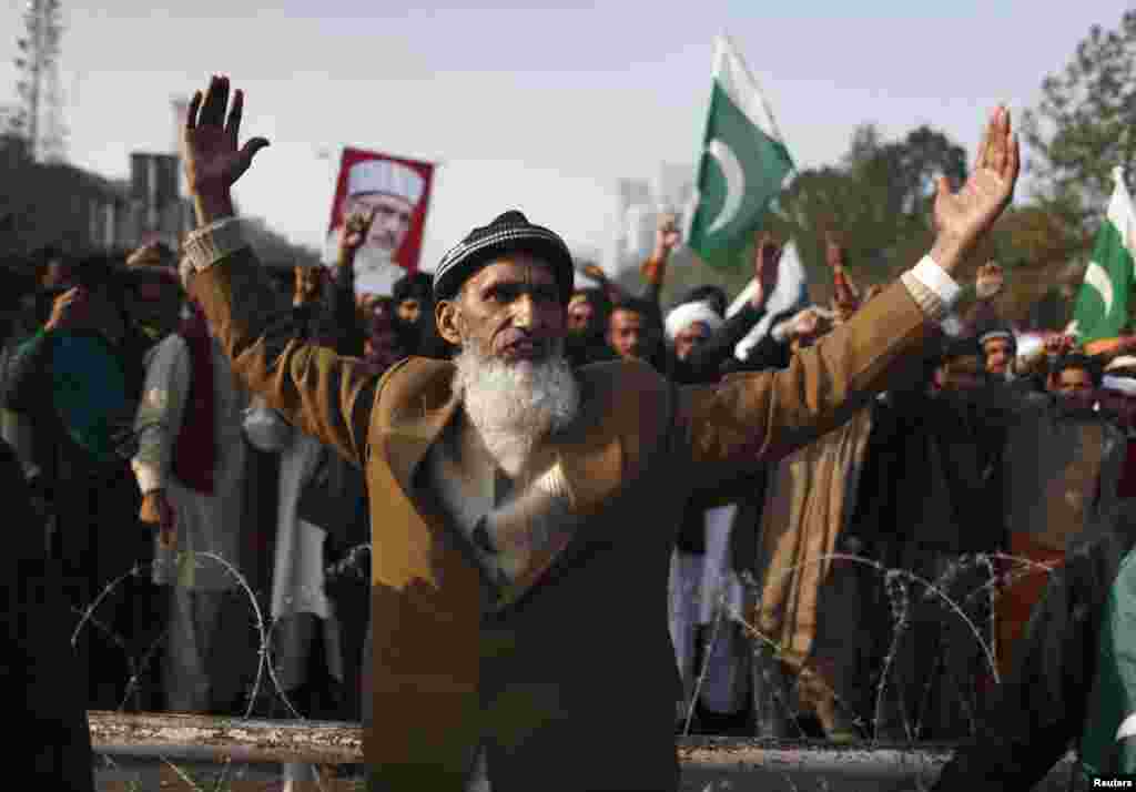A supporter takes part in a rally in Islambad before the main group of marchers arrives.