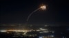 Rockets fired from southern Lebanon are intercepted by Israel's Iron Dome air-defense system over the Upper Galilee region in northern Israel on August 4.