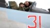 In a photo released by his press service on December 27, 2019, Armenian Prime Minister Nikol Pashinian is shown being briefed on the technical capabilities of Su-30SM fighter jets while sitting inside a cockpit.