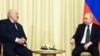 Russian President Vladimir Putin (right) meets with Belarusian ruler Alyaksandr Lukashenka outside Moscow on February 17.