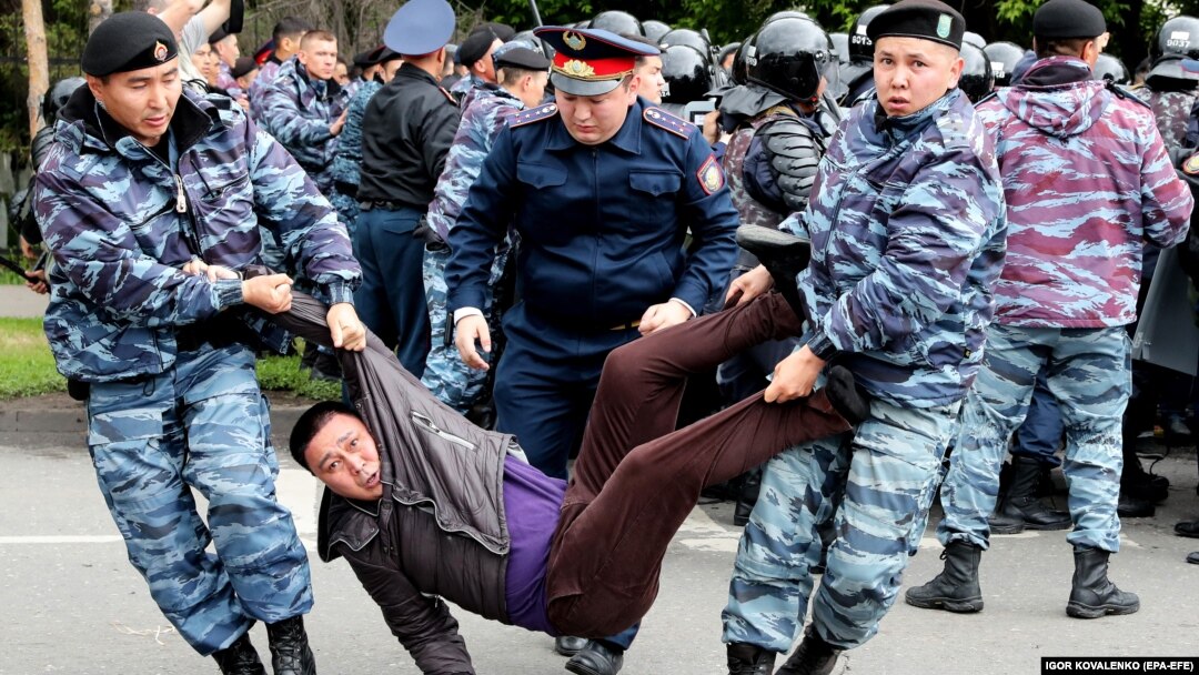 Police detain opposition supporters during a protest calling for free and fair elections during the presidential election in Nur-Sultan, Kazakhstan, in June 2019. 