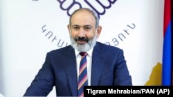 Armenian acting Prime Minister Nikol Pashinian speaks to party colleagues after parliamentary elections, in Yerevan on June 21.