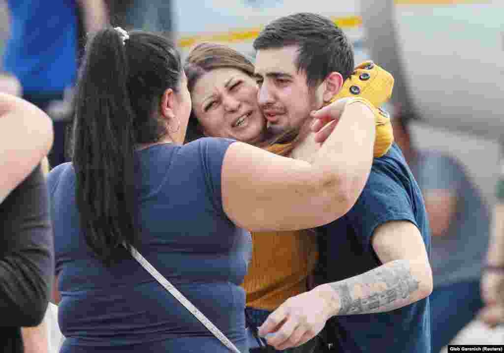 A freed Ukrainian prisoner is greeted by relatives upon arrival in Kyiv amid emotional scenes at Boryspil International Airport.