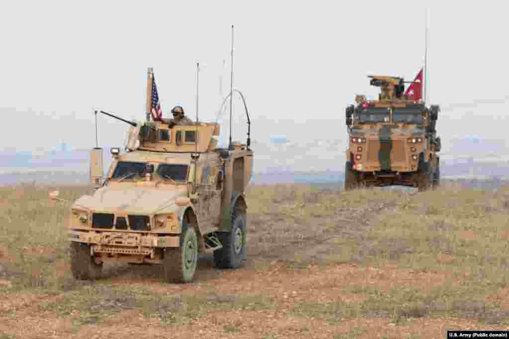 U.S. and Turkish forces conduct joint patrols on the outskirts of Manbij in November 2018. Syria is today an "ever congested" battle space, with U.S.-, Turkish-, Syrian-, Russian-, and Iranian-affiliated fighters all variously cooperating and clashing in the country. 