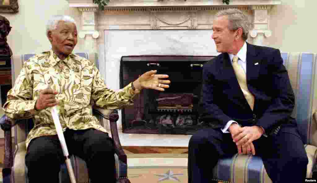 U.S. President George W. Bush meets with Nelson Mandela in the Oval Office of the White House in May 2005.