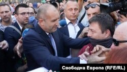 Bulgarian President Rumen Radev (left) came out and thanked protesters for their support.