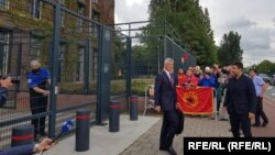 Kosovar President Hashim Thaci (center) leaves the prosecutor's office in The Hague on July 16.