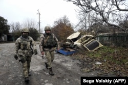 Ukrainian soldiers patrol at the front line with Russia-backed separatists in Shyrokyne in November 2018.