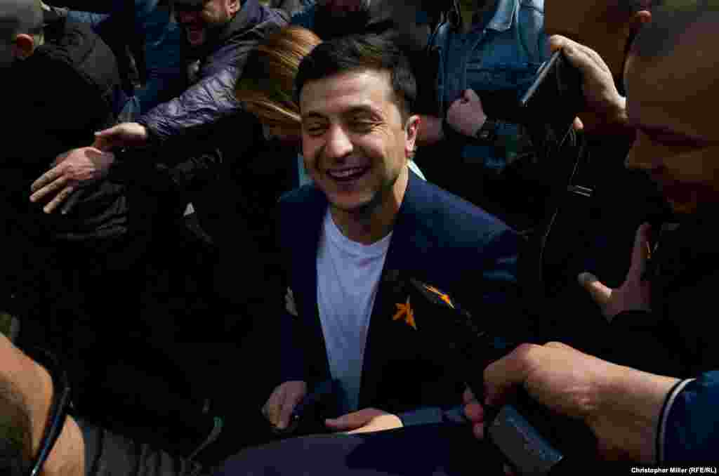 Presidential candidate Volodymyr Zelenskiy outside a Kyiv polling station after casting his ballot. Asked by RFE/RL what would be the first issues he would tackle if elected president, he answered: "The war and corruption."