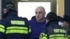 Ніка Мелія (с) під час затримання
