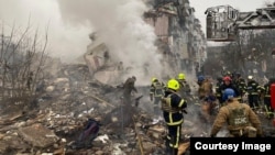 Ukrainian rescuers work at the site of a Russian missile strike on Poltava on February 1.