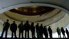 Vigilantes on both sides of the divide in Ukraine have formed groups to protect buildings that they control. In this picture, antigovernment activists protect Kyiv's "Ukrainian House," which was seized by protesters on January 26. 