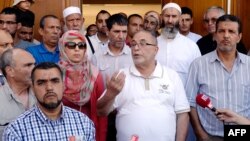 The rector of Lyon's Grand Mosque, Kamel Kabtane (center), has called for government action to counter the fear of Muslims.