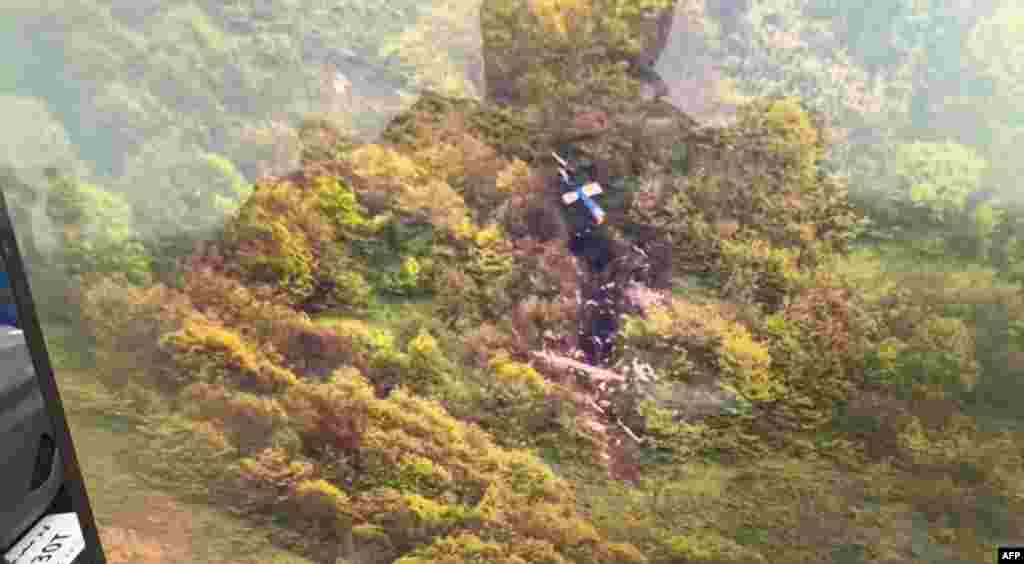 Iran's Red Crescent Society has released this picture, which appears to show pieces of the helicopter after it crashed. Iranian state television said on May 20 that the helicopter had fallen foul of poor weather conditions.
