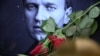 (FILES) Roses are laid at a picture of late Russian opposition leader Alexei Navalny at a makeshift memorial in Frankfurt am Main, western Germany, on February 29, 2024.
