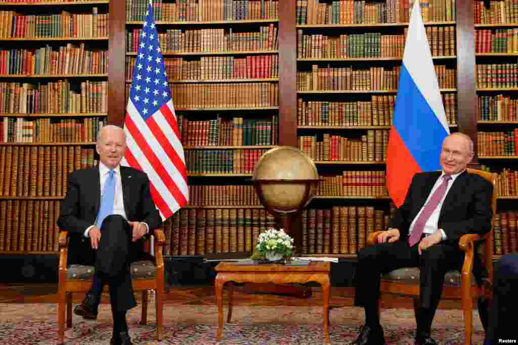 Biden and Putin inside a library in the historic villa. 