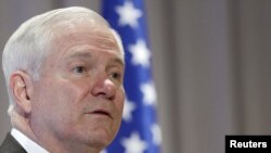 U.S. Defense Secretary Robert Gates addresses military officers at the Naval Museum in St. Petersburg