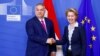 Hungarian Prime Minister Viktor Orban (left) shakes hands with European Commission President Ursula von der Leyen at commission headquarters in Brussels in February 2020.