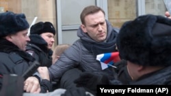 Russian opposition leader Aleksei Navalny has been accused of hitting police officers while being detained on January 28. 