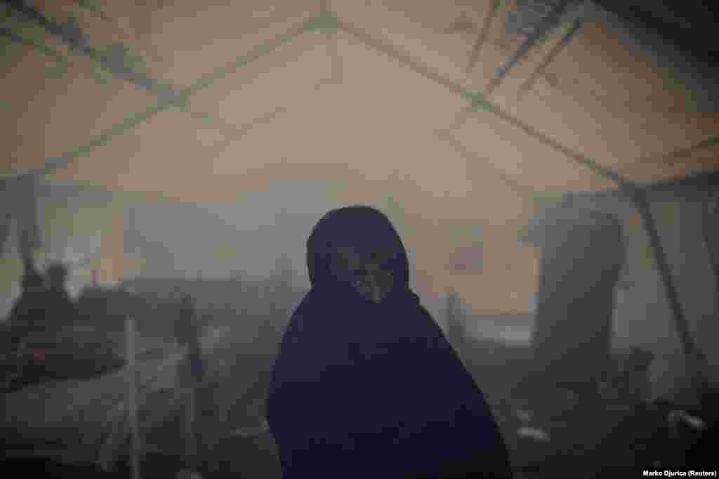 But a UN official has demanded more be done to house the stranded migrants in Bosnia as winter approaches, calling the Vucjak camp “absolutely inappropriate and inadequate for accommodating human beings.” This migrant is seen in a smoke-filled tent, apparently from a fire lit to warm up the flimsy shelter. 