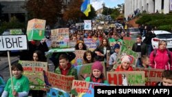 Children protest against climate change in the center of Kyiv on September 20.