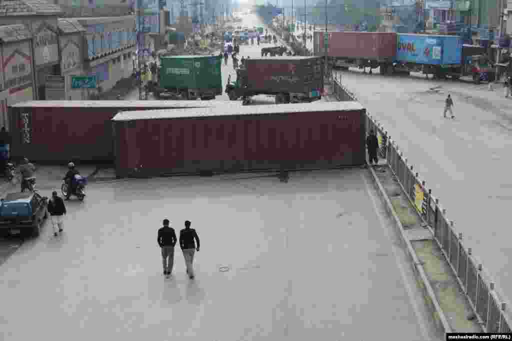 Shipping containers have also been put into service to keep demonstrators in the designated areas.