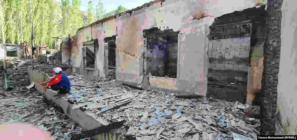 A burned-out house in the Tajik village of Somoniyon in the Isfara district on May 2. The violence along the Tajik-Kyrgyz border followed a dispute over the installation of surveillance cameras at a water distribution point near Tajikistan's Vorukh exclave, drawing in security forces from both countries. 