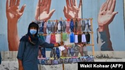 A street vendor sells face masks in Kabul.