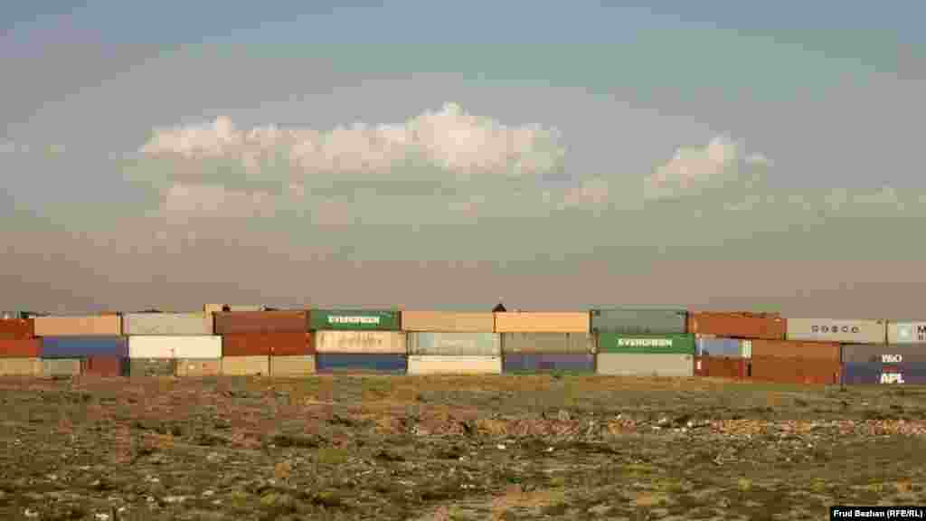 A huge row of shipping containers outside Bagram Airfield. 