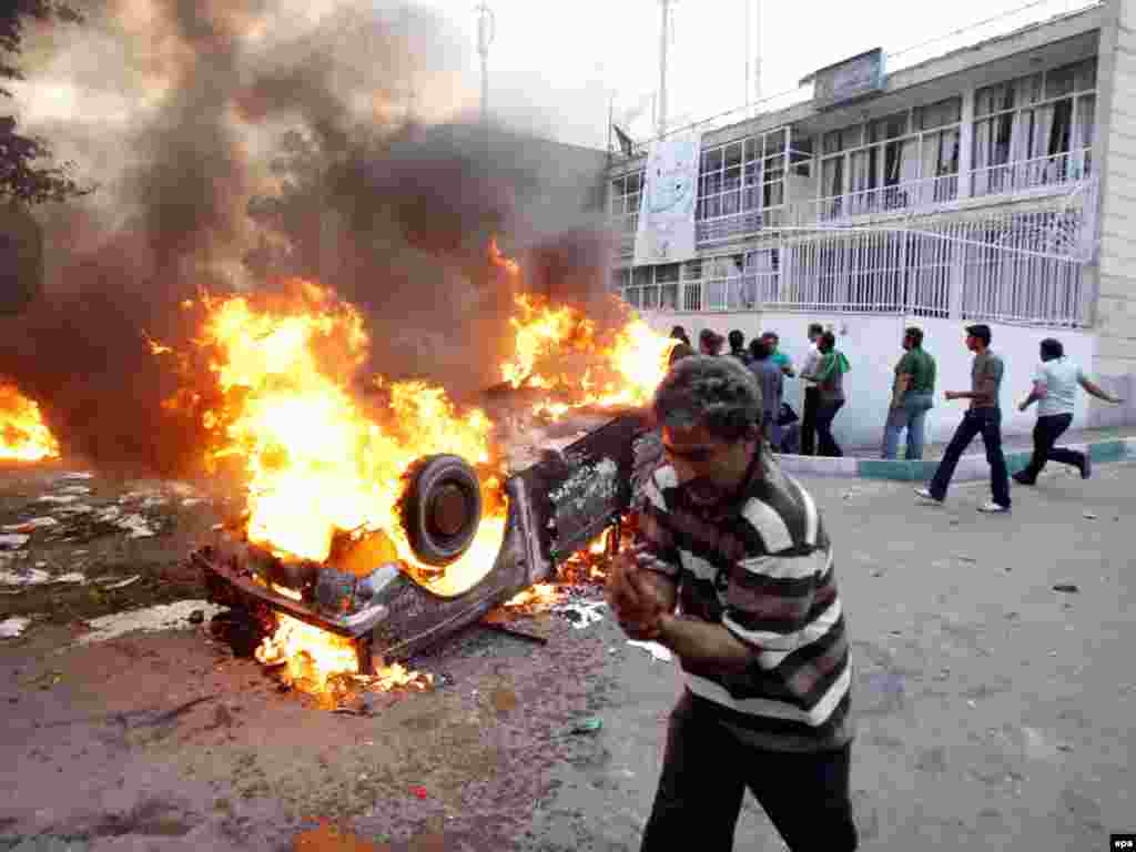 The demonstration turned violent as protesters clashed with members of the Basij militia. - There were conflicting reports on how the violence erupted. Some said protesters attacked a building housing members of the pro-government militia, while others said militiamen made the first strike and opened fire.