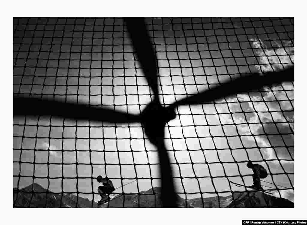 First Prize, Sport: Skiers compete in the Men's Ski Cross event at the Winter Olympics in Sochi, Russia. (CTK/Roman Vondrous)
