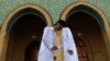 Sunni worshipers exchange greetings after their Eid Al-Fitr prayers to mark the end of the Muslim holy fasting month of Ramadan at a Sunni mosque in Baghdad in August.