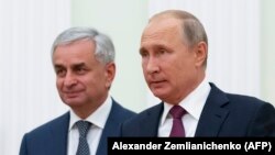 Russian President Vladimir Putin (right) with Abkhazia's separatist leader Raul Khajimba in Moscow last year.