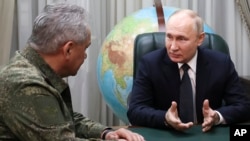 Владимир Путин жана Сергей Шойгу.
