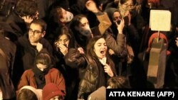 Iranian students chant slogans as they demonstrate following a tribute for the victims of Ukrainian airliner that was shot down over Tehran ion January 8.
