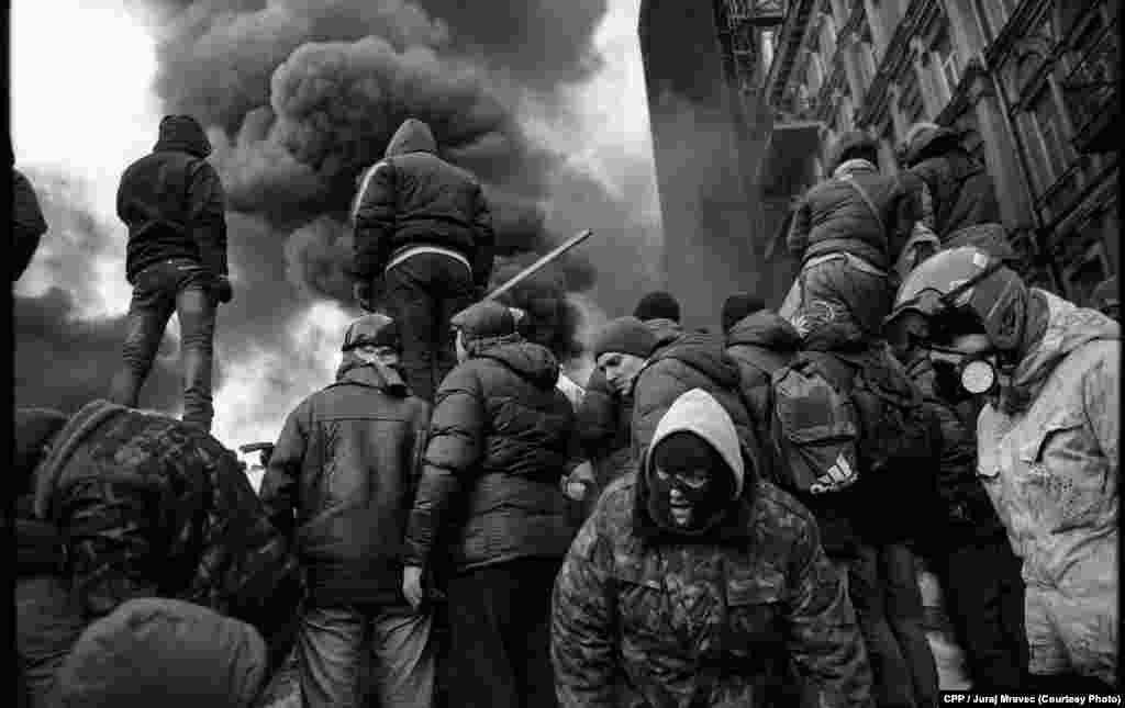 Second Prize, General News: Protesters on the barricades in Kyiv, Ukraine. (Juraj Mravec)