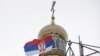 Srpska zastava kraj nove crkve u izgradnji, dizajnirane u ruskom stilu, u selu Banstol na severozapadu Srbije, 11. januara 2019.